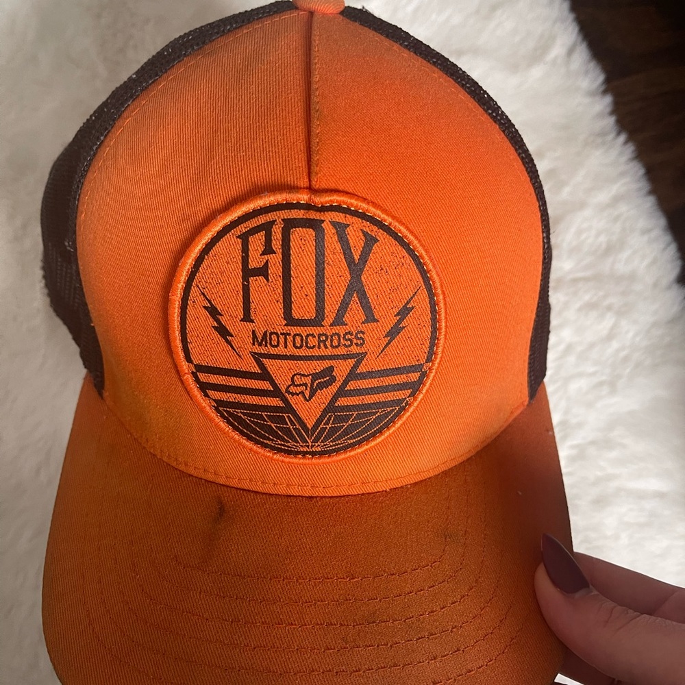Racing fox hat for men. Used. Orange color.